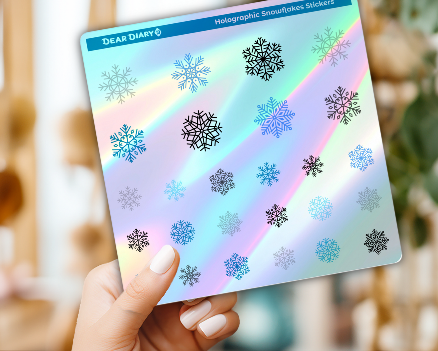 close-up of holographic snowflake planner stickers shining in light